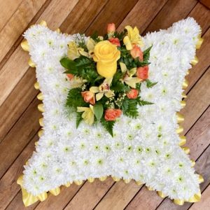A lovely massed cushion available in any colours. Ribbons in colours of your choice 24 hours notice, or similar design same day delivery. Due to seasonal variations some items may be substituted to produce a display of equal quality and value.