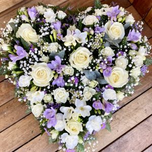 solid heart in bright colours funeral tribute heart can be in any colours of your choice. Same day delivery.
