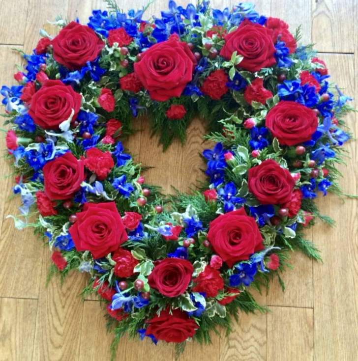 An stunning open heart tribute. Deep Red Roses with contrasting purple veronica and subtle foliage. Available in any colour. 24 hours notice or similar design same day delivery. Due to seasonal variations some items may be substituted to produce a display of equal quality and value. We can offer delivery by our own drivers or click and collect is available. Professionally arranged by our expert florists with care. Delivered by hand by our own driver. Due to seasonal variations some items may be substituted to produce a display of equal quality & value.