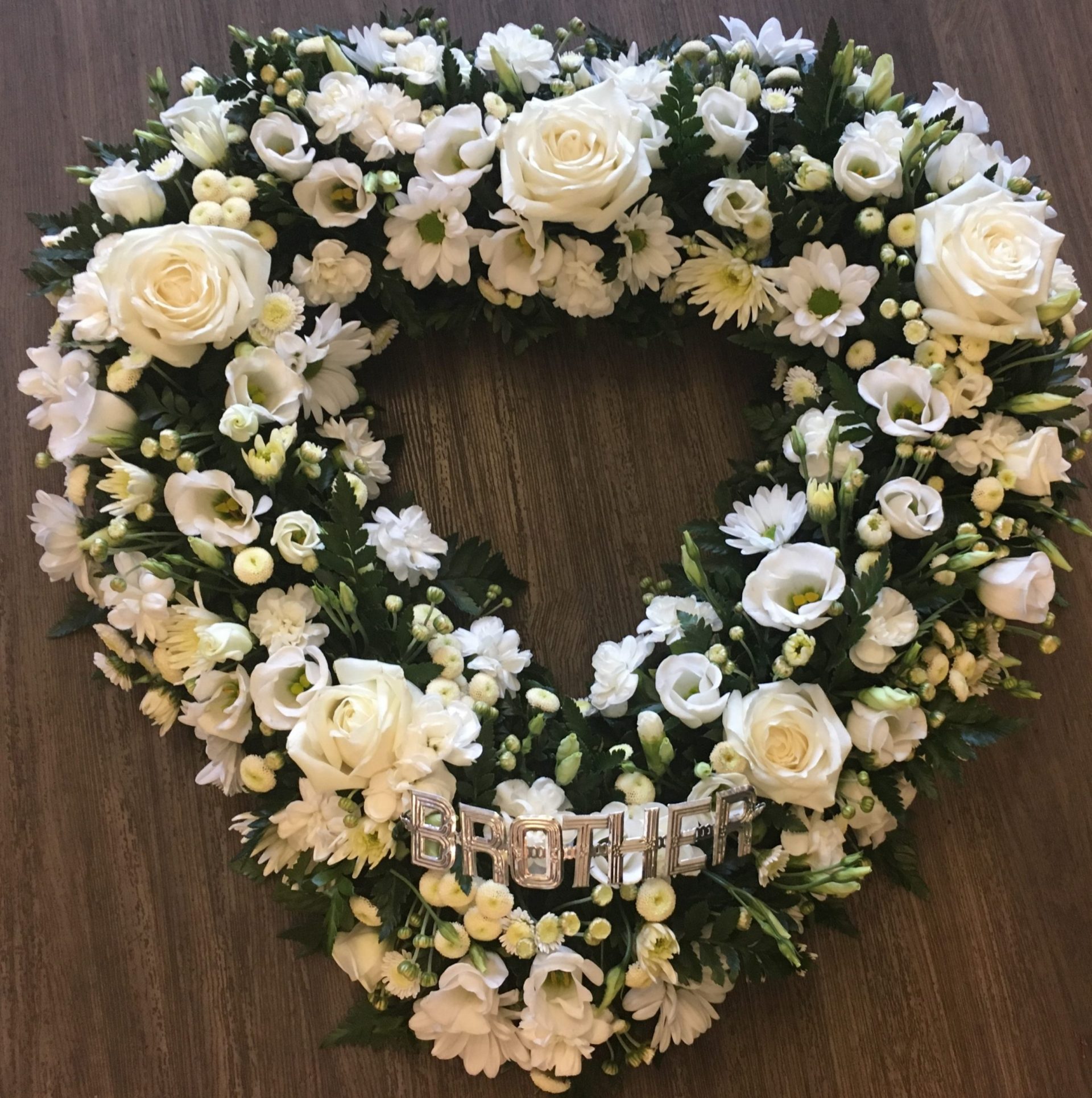 A pretty and delicate open heart can be in any colours of your choice. Same day delivery. Due to seasonal variations some items may be substituted to produce a display of equal quality and value.